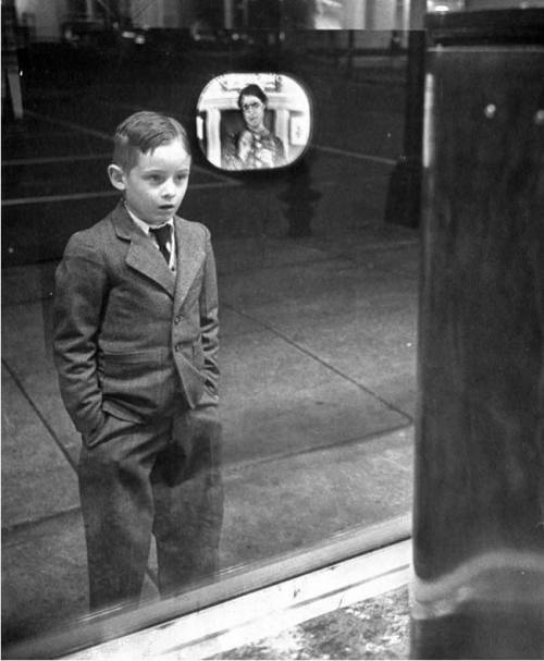 A boy watches television for the first time through a shop window, 1948. Nudes &amp; Noises  