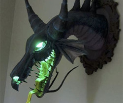 awesomeshityoucanbuy:  Paper Mache Dragon TrophyDisplay to your house guests that you’re a true dragon slayer with this unbelievable and one of a kind paper mache dragon trophy. Designed to look like the Maleficent dragon from the Sleeping Beauty movie,