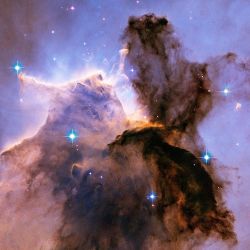 the-future-now:  Stellar Spire in the Eagle Nebula: Appearing like a winged fairy-tale creature poised on a pedestal, this object is actually a billowing tower of cold gas and dust rising from a stellar nursery called the Eagle Nebula. The soaring tower