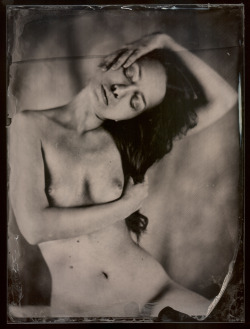 treml:Ambrotype by me (2014) - When dipping the plate into the silver I stuck for a second which was causing the line. Accidently it is kind of matching with the pose, yea :) 