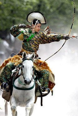 thekimonogallery: An archer dressed in traditional samurai garb displays Yabusame (archery while on horseback).  Japan.  Image via Pinterest