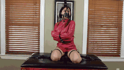 Wrapped tight in her straitjacket, belts ensure she stays trapped in place. #bondage #gif http://bit.ly/2dBAiQz