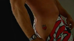Shawn Michaels showing off his tattoo