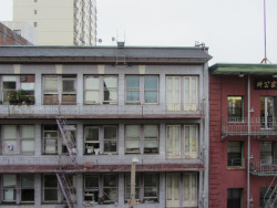 lookarounditshappening:  morning view, san francisco, chinatown, 857 clay street, flat 412see that window? the one on the top floor w/ the half-open curtain? the first night i moved in, i saw two little heads poking through the curtain; they must have