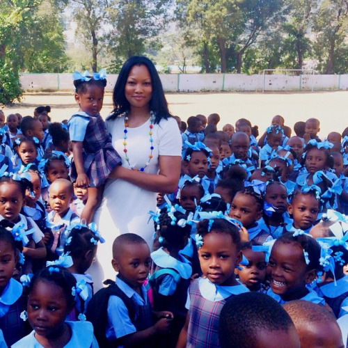 flyandfamousblackgirls: Haitian Actress Garcelle Beauvais visiting Haiti and playing with the babies