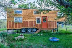 poweredbydiesel:  arcountryboy:  dirt-road-anthem:  juice-76:  tinyhousetown:  Eric and Oliver’s tiny house  #suchapossibilitysoon  @lizzielethal  Not really a tiny house fan. It this is bad ass  I wonder what type of truck you’d need to pull it.