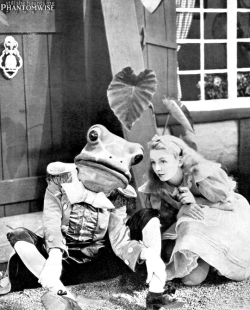 still-she-haunts-me-phantomwise:  Sterling Holloway as the Frog Footman and Charlotte Henry as Alice from Alice in Wonderland (1933).This is my scan; please do not repost 
