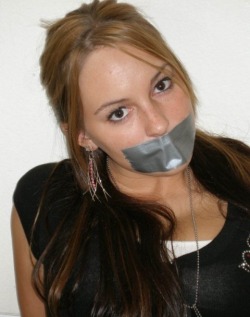 silent-screams45:  Sexy girl gagged with duct tape