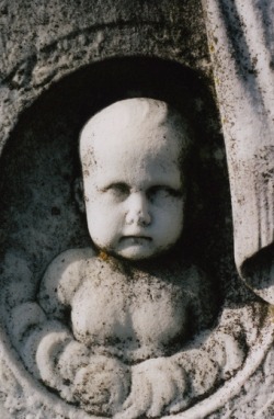 The Baby Faced Asylum Tombstone Near the center of Cedar Hill Cemetery is a large tombstone with a 3-D image of a baby&rsquo;s face carved on it. According to legend, if you stare at the baby&rsquo;s face for a while and then turn away, when you look