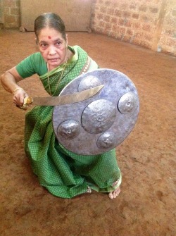 superheroesincolor:  Defying age with a sword: Meenakshi Gurrukkal, Kerala’s grand old Kalaripayattu dame  “Meenakshi Gurukkal crouched low, sword poised; her eyes unblinking as she faced her opponent in the mud-paved ‘kalari’ or arena. From