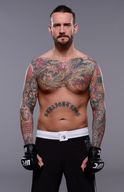 thepunknation:UFC Photoshoot Part One‘DALLAS, TX - MARCH 13:  Phil ‘CM Punk’ Brooks poses for a  photo during a UFC photo session at the Hilton Anatole Hotel on March  13, 2015 in Dallas, Texas. (Photo by Mike Roach/Zuffa LLC/Zuffa LLC via  Getty