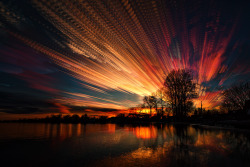 matt-molloy:  186 photos of the sunset merged into one image using the lighten layer-blending mode in photoshop. I like the pattern in the clouds created from the interval between shots.