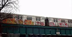 nyc-subway:  Rare sight of graffitied train resting above Brooklyn subway underpass by Robert S. Photography
