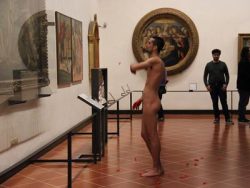 aestupid:  A naked Spanish man throws flower petals at the picture of the Birth of Venus by Botticelli   