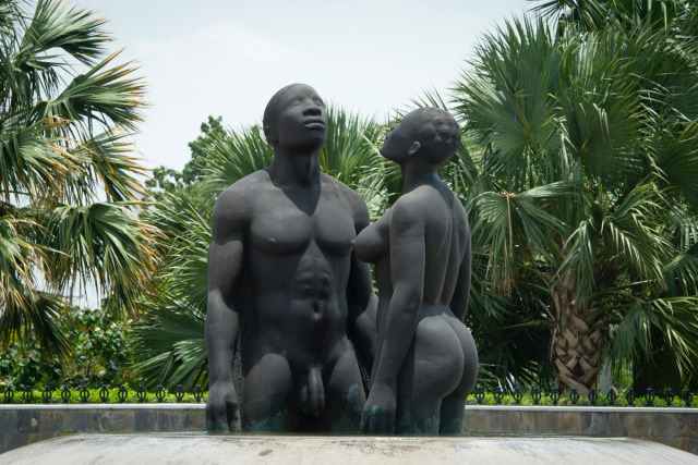 The bronze sculpture “Redemption Song”, depicting a man and woman emerging from a pool of water, meant to wash away the pain of slavery is seen in Kingston (Jamaica) on June 29, 2012.