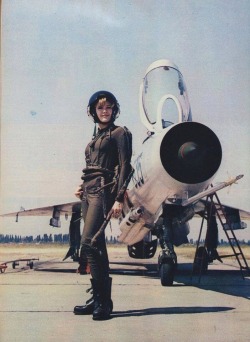 arrogant-bastard-american:  A lady of the Yugoslavian Air Force poses beside her (feel free to correct me if I fuck this up) Sukhoi Su-17.  Looks like a mig-21 but can&rsquo;t get a gr8 look at the wings