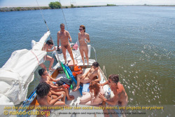 This Small Naked Club Group Is Enjoying A Rest After Swimming Around The Boat.  Join