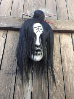 sixpenceee: This is a beautiful wall mounted hanging mask. It is made of hard resin,  has a wig attached with a hand styled hair style complete  with chopsticks. Link to mask. 