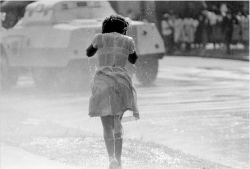 thesociologicalcinema:A young black woman, soaked by a fireman’s hose as an anti-segregation march is broken up by police on May 8, 1963. In the background is a police riot wagon.Photo credit: AP — in Birmingham, Alabama.