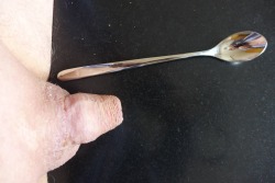 showing the spoon near my tiny cock
