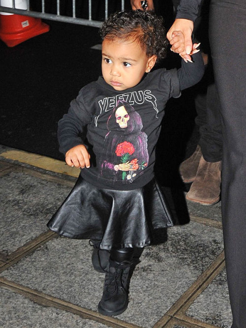 peoplemag:  Aww! Kim and Kanye’s little lady North West rocks Paris Fashion Week with an adorable leather skirt (from her mom’s Kardashian Kids line, of course!) and Dad’s Yeezus tee. 