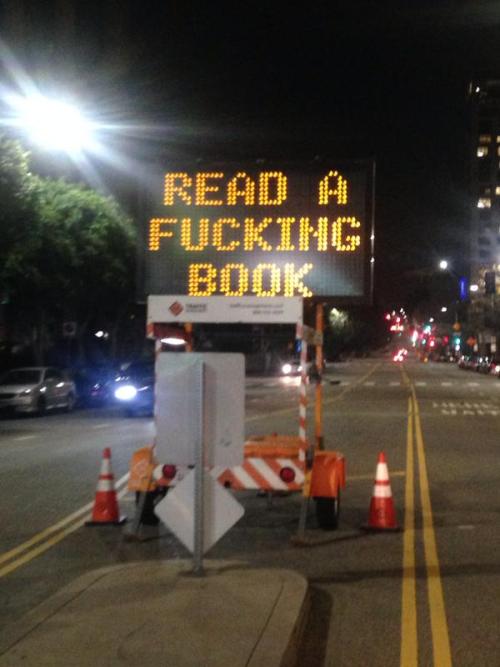 laughingsquid:  Literature Lover in Los Angeles Hacks a Road Sign to Say ‘Read a Fucking Book’