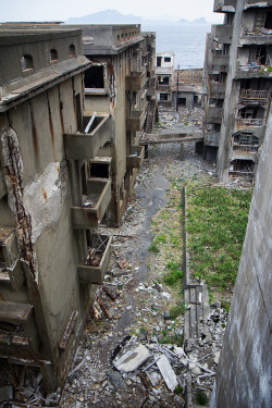 destroyed-and-abandoned:  Japan’s abandoned Hashima Island Source: Chris Luckhardt (flickr)motionblur:This is a view of Japan’s abandoned Hashima Island from the publicly inaccessible residential area.  The island has been abandoned since the Spring
