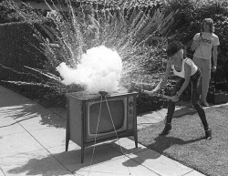 vaticanrust:  Wendy O Williams of the Plasmatics smashing a television with KROQ  