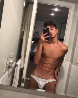 coolbrandonanthonythings:Wonderful tan shoulders and pecs, plus beautiful ripply abs lead into his skimpy low undies where his considerable man size penis forms a clear outline in the thin material.  Sexy pubes enticingly exposed somewhat above the low