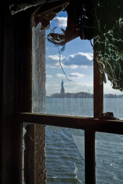 ianference:This is the view from the Measles Wards in the Ellis Island Hospital Complex out to the Statue of Liberty.  I find it deeply ironic that this was the view of tens of thousands of hopeful immigrants - right before they were deported back to
