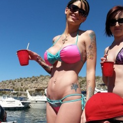 AZ lake party girl flaunting not only her big implants, but also her hot bod and dancing moves. Crazy that there is a party barge fitted with pink stripper poles.