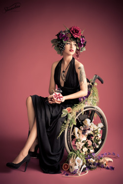 qcrip:  L E G E N D A R Y Photos by Carey Lynne Fruth and Sophie Spinelle of Shameless Photography ( he / him or they / them please ) Instagram: pansystbattie [image desc: 5 images of me, a nonbinary indian wheelchair user wearing a flower headdress,