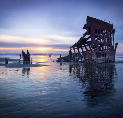 seasideoregon:  ↴ Taken By 📷: @MorriseyProductions  Today’s photo features the Peter Iredale Ship wreck which ran ashore near the mouth of the Columbia River in 1906 on the beach in Ft Stevens State Park. 🔥🔥🔥 ______________________________________