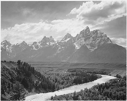earthstory:Capturing the national parksThis photo shows the Teton mountain range towering over the Snake River on the plains below. It was taken during the 1930’s by famed photographer of American landscapes Ansel Adams.For this post, I’ll just let