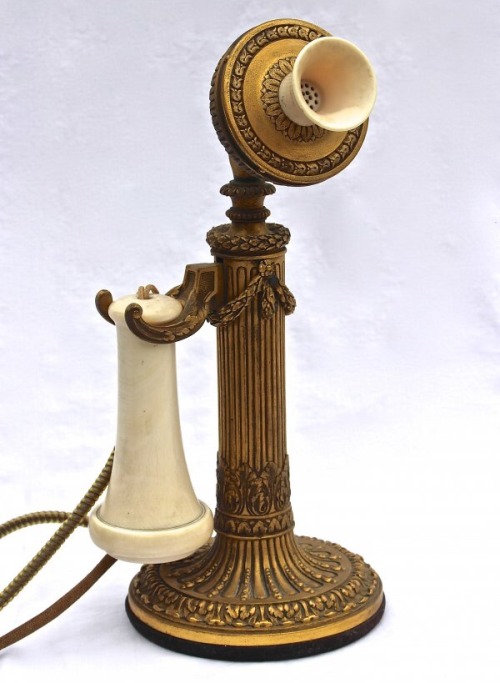 the1920sinpictures:  1920 This is a hand-made gilded brass candlestick telephone, with an ivory receiver and mouthpiece, by E.F. Caldwell &amp; Co., New York. From Karen Starr Venturini, FB.