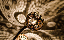 archiemcphee:  Lithuanian artist and craftsman Vainius Kubilius transforms coconut shells into radiant jewels that cast dazzling patterns of light and shadow in every direction. Kubilius’ awesome handmade lamps are called Nymphs and each one is unique.