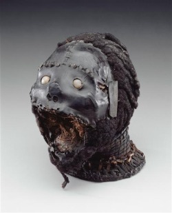 Late 19th-early 20th century, African art from Nigeria. The mask is built on a real human skull, hung with antelope skin, and covered with human hair on the skull and chin.
