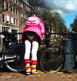 emma-abdl:    I’m having a fun day in Amsterdam (10 pics)  It’s a lovely day in and I’m having a wonderful stroll through Amsterdam. I am wearing my pink PVC jacket and rainbow leg warmers. And a very short skirt so I can do lots of diaper flashing!I