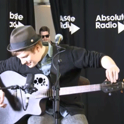 deactivated759365:  Andy sneaks in and goes for this kiss at Absolute Radio 
