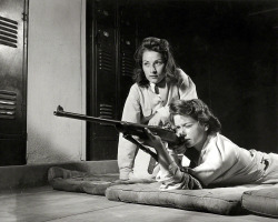 Alfred Palmer - Training in marksmanship helps girls at Roosevelt High School in Los Angeles develop into responsible women. Part of Victory Corps activities, August 1942.