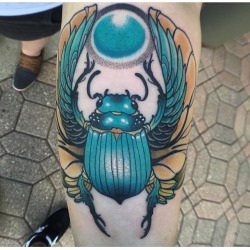 fuckyeahtattoos:  Hieroglyph inspired scarab done by Emanuel Mendoza at Iron Clad Co in Michigan. Rising sun, start again.