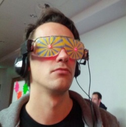 lasergrey: Xander was excited, going through the convention. All the latest gadgets, games and more. He stopped at a stall with some funky looking glasses. The attendant told him it was similar to the Oculus Rift, making the wearer truly believe he was