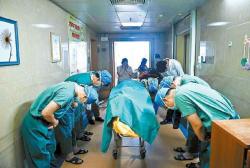 min8:fakhrafakhra:   stunningpicture:  Chinese doctors bowing down to an 11 year old boy diagnosed with brain cancer who managed to save several lives by donating his organs to the hospital he was being treated shortly before his death.  This should go