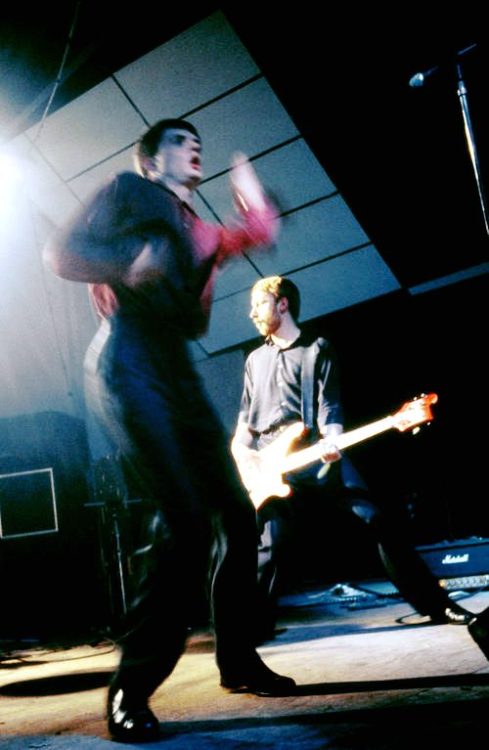 Joy Division&rsquo;s Ian Curtis and Peter Hook live at the Electric Ballroom in London, 26th October, 1979. Photography by Chris Mills. Nudes &amp; Noises  