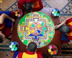 nationalpostphotos:  Colorful sand mandala — Tibetan Monks from the Tashi Lhunpo Monastery complete a Chenrezig Sand Mandala in Salisbury Cathedrals Chapter House  on October 3, 2013 in Salisbury, England. The monks, who started the painstaking process