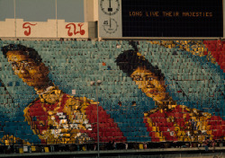 natgeofound:  King Bhumibol and Queen Sirikit in flash cards at a stadium in Bangkok, Thailand, July 1973.Photograph by Black Star Agency