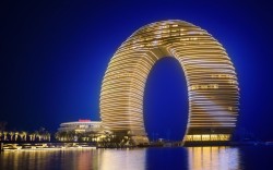Epitome of opulence (the newly opened Sheraton Huzhou Hot Springs Resort towers over Taihu Lake, near Shanghai. Its lobby is floored in Afghanistan white jade and the lobby ceiling is hung with lamps made of 20,000 Swarovski crystals)