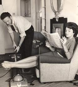 men-doing-housework:  Here, a man vacuums while his wife educates herself by reading the paper.  the right way of life