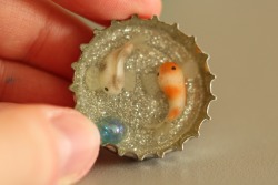 tiny-claydragon: A little experiment with resin. They will be made into magnets. The fish are made from polymer clay and the “water” is resin. The octopuses glow in the dark. 