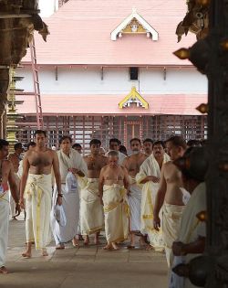 arjuna-vallabha: Kerala temple interior.    Just as if a garment is expected for a policeman, lawyer or judges and the like, many temples in South India have a dress code for those who attend them, for this there is no exception     Here you can see